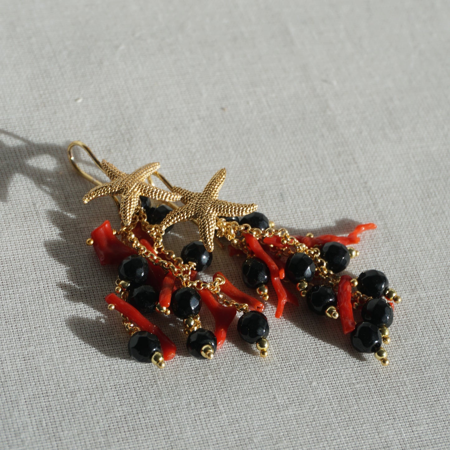 Orecchini Stella marina con corallo