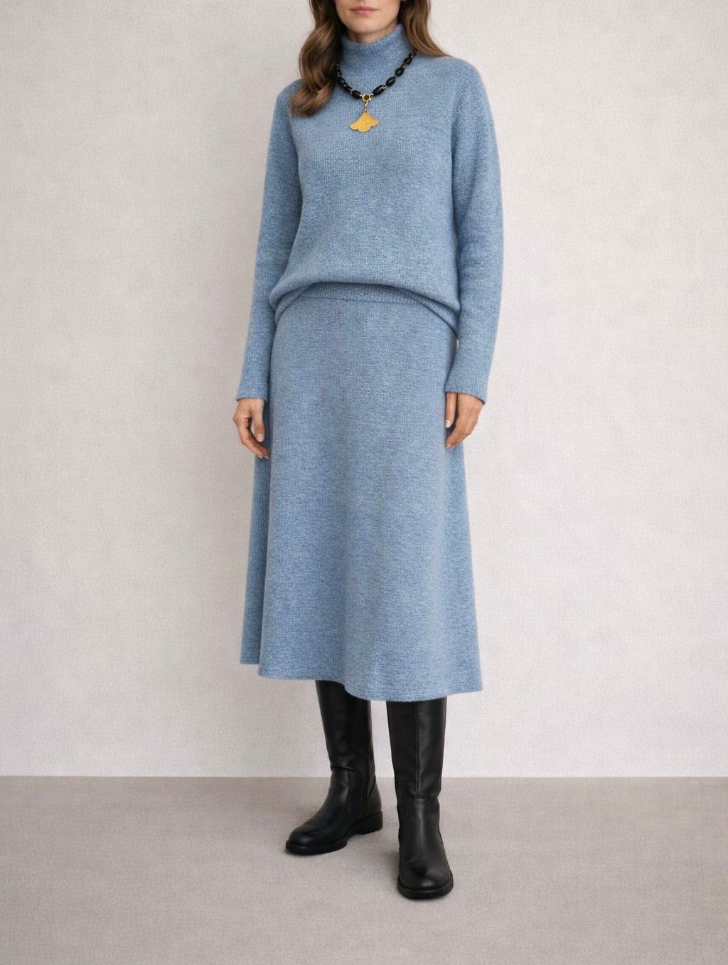 Slightly flared midi knit skirt.