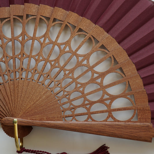 Large burgundy circle fan