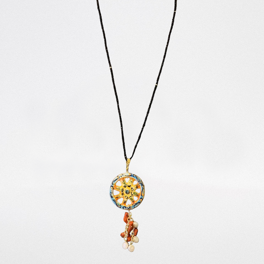 Collar de Ónix, Rueda siciliana y perla